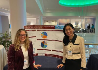 Dr. Gerde and student standing by research poster.