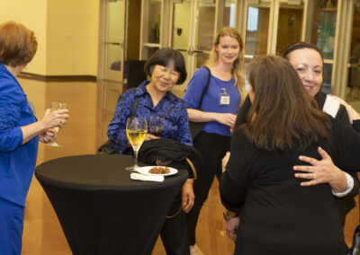 A group of people mingling and eating at the 2025 Early Childhood Summit.