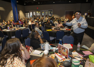 Man speaking to the audience at the Texas Play & Development Conference.